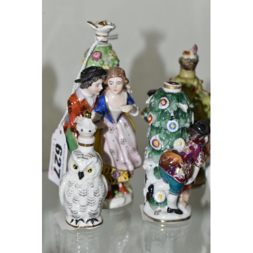 627 - FIVE LATE 19TH AND 20TH CENTURY CONTINENTAL PORCELAIN SCENT BOTTLES, three of figural form with encr... 