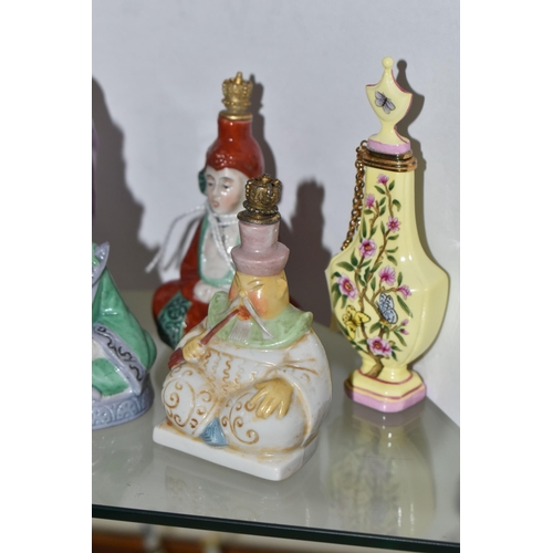 628 - FIVE 20TH CENTURY PORCELAIN SCENT BOTTLES, comprising a yellow Halcyon Days bottle, four Chinese fig... 