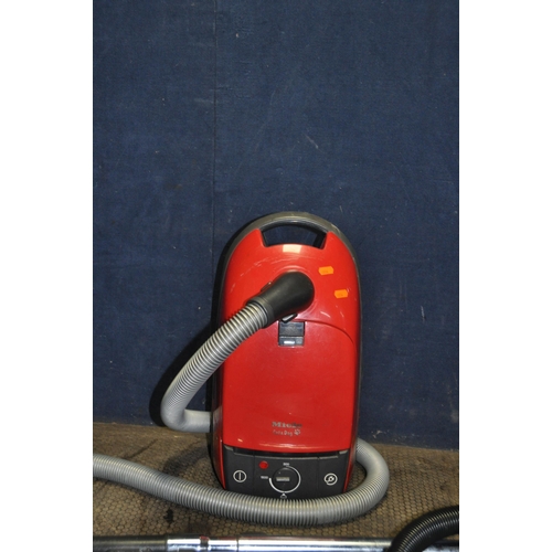 1055 - A MIELE CAT AND DOG VACUUM CLEANER (no floor head) and a Tesco vacuum cleaner ( pipework taped over ... 