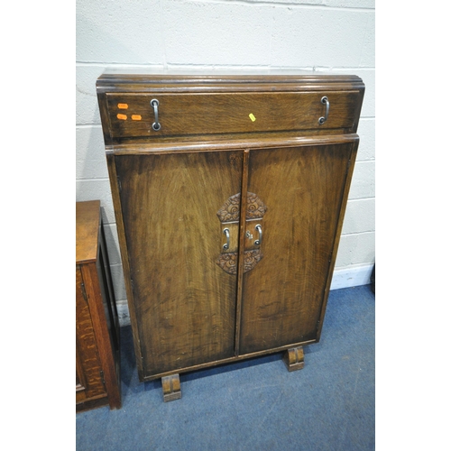 1215 - AN OAK TWO DOOR CUPBOARD, with carved foliate panels, width 100cm x depth 49cm x height 75cm, along ... 