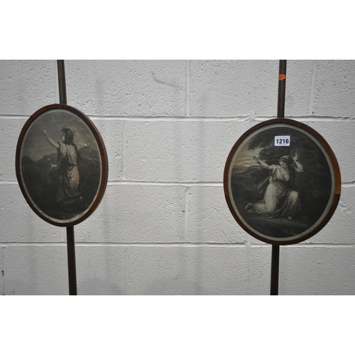 1216 - A PAIR OF REGENCY MAHOGANY POLE SCREENS, carved finial, each screen enclosing a printed silk image o... 