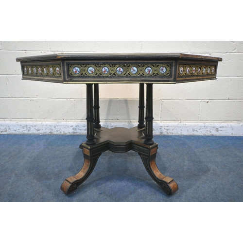 1222 - A MID TO LATE 19TH CENTURY EBONISED AND AMBOYNA OCTAGONAL CENTRE TABLE, with brass and porcelain pla... 