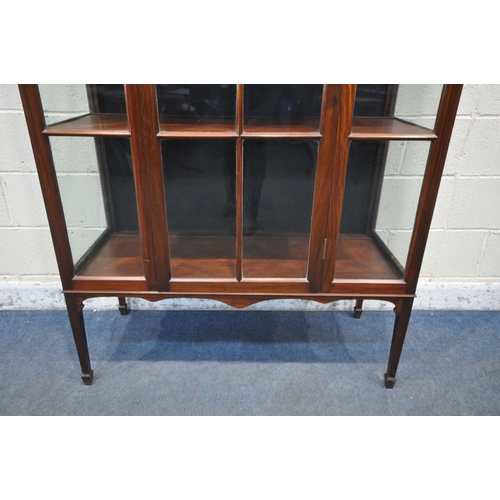 1227 - AN EARLY 20TH CENTURY MAHOGANY SINGLE DOOR DISPLAY CABINET, enclosing three shelves, on square taper... 