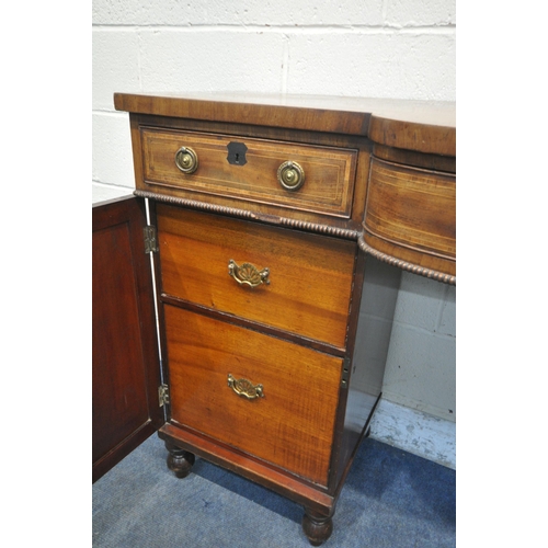 1229 - A GEORGIAN MAHOGANY AND CROSSBANDED PEDESTAL SIDEBOARD, central bowfront section, three frieze drawe... 