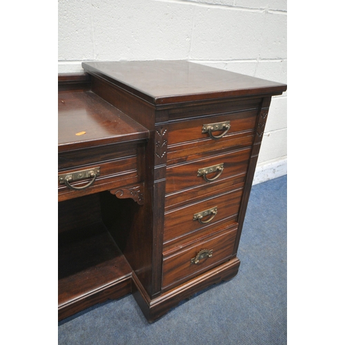 1232 - AN EDWARDIAN MAHOGANY DESK, fitted with nine drawers, on casters, width 152cm x depth 56cm x height ... 