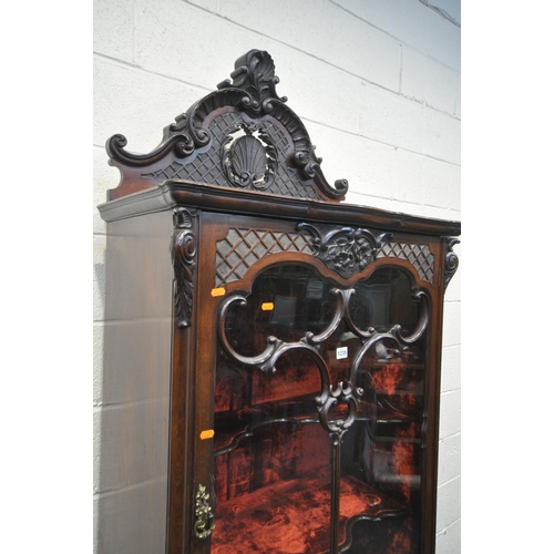 1235 - AN EARLY 20TH CENTURY MAHOGANY SINGLE DOOR CABINET, with a triple shaped shelves, and red velvet int... 