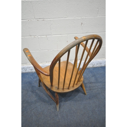 1236 - A MID CENTURY ERCOL WINDSOR ARMCHAIR, with a spindle hoop back (condition report:  water stained and... 