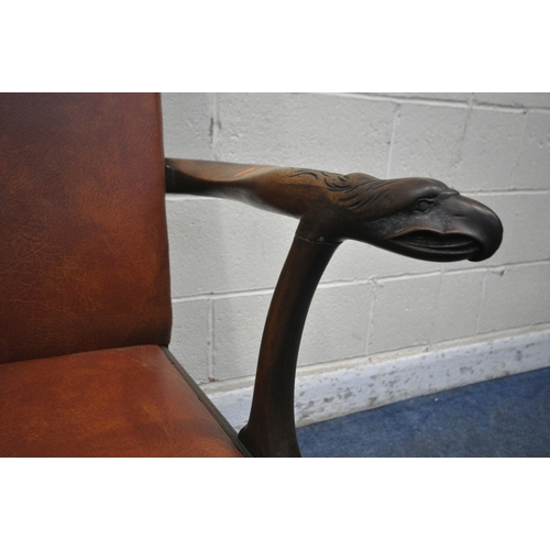 1237 - A GEORGIAN MAHOGANY ARMCHAIR, reupholstered with brown leatherette, the open armrests with an Griffi... 