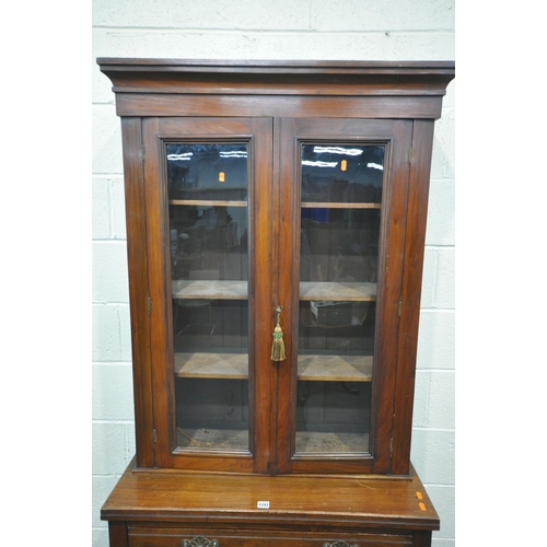 1242 - AN EDWARDIAN WALNUT GLAZED BOOKCASE, above a single drawer and double panel doors, width 89cm x dept... 