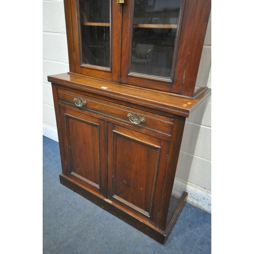 1242 - AN EDWARDIAN WALNUT GLAZED BOOKCASE, above a single drawer and double panel doors, width 89cm x dept... 