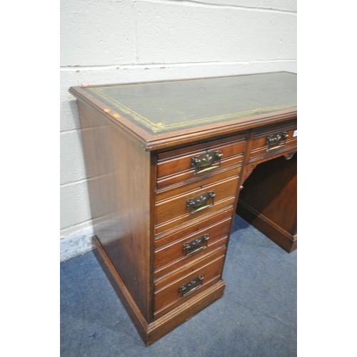 1247 - AN EDWARDIAN WALNUT KNEE HOLE DESK, with a green gilt tooled leather inlay writing surface, and an a... 