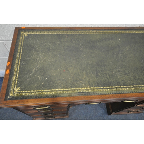 1247 - AN EDWARDIAN WALNUT KNEE HOLE DESK, with a green gilt tooled leather inlay writing surface, and an a... 