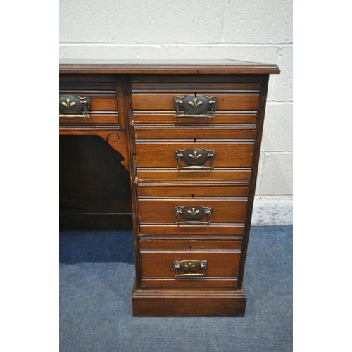 1247 - AN EDWARDIAN WALNUT KNEE HOLE DESK, with a green gilt tooled leather inlay writing surface, and an a... 