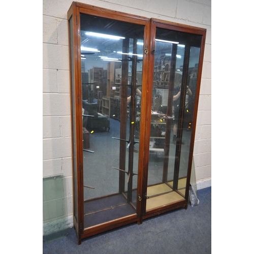 1263 - A PAIR OF OPPOSING EARLY 20TH CENTURY MAHOGANY DISPLAY CASES, enclosing a mirrored interior, and a t... 