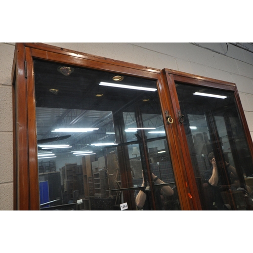 1263 - A PAIR OF OPPOSING EARLY 20TH CENTURY MAHOGANY DISPLAY CASES, enclosing a mirrored interior, and a t... 