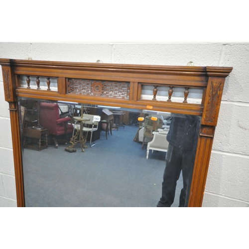 1267 - AN EDWARDIAN WALNUT OVERMANTEL MIRROR, with turned spindles and open fretwork, 110cm x 114cm (condit... 