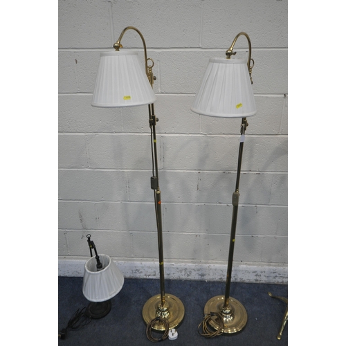 1272 - A PAIR OF BRASS STANDARD LAMPS, with an adjustable height, along with another brass lamp with a fabr... 