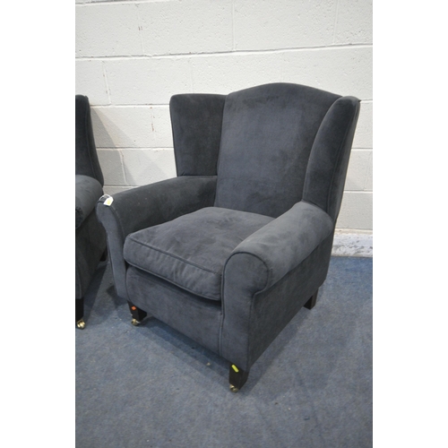 1276 - A PAIR OF DARK BLUE UPHOLSTERED ARMCHAIRS, along with a brown footstool (condition report: in need o... 