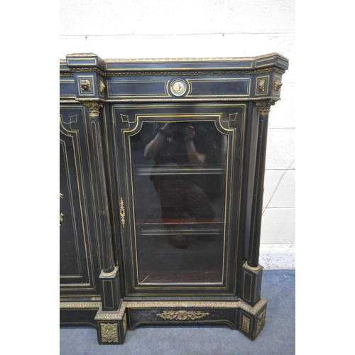 1277 - A 19TH CENTURY EBONISED AND GILT BRASS CREDENZA, with four moulded tops supporting Corinthian column... 