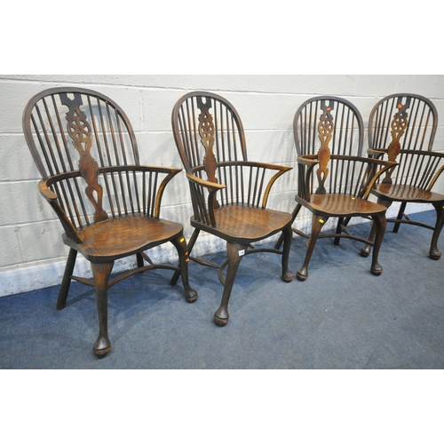 1286 - A SET OF FOUR EARLY 20TH CENTURY ELM AND BEECH HOOP BACK WINDSOR ARMCHAIR, with a wheel splat back, ... 