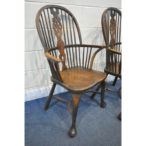 1286 - A SET OF FOUR EARLY 20TH CENTURY ELM AND BEECH HOOP BACK WINDSOR ARMCHAIR, with a wheel splat back, ... 