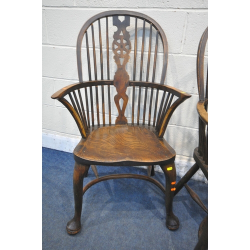 1286 - A SET OF FOUR EARLY 20TH CENTURY ELM AND BEECH HOOP BACK WINDSOR ARMCHAIR, with a wheel splat back, ... 