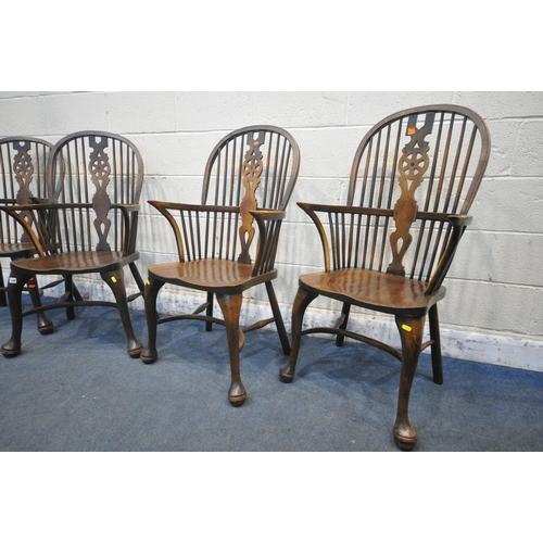 1286 - A SET OF FOUR EARLY 20TH CENTURY ELM AND BEECH HOOP BACK WINDSOR ARMCHAIR, with a wheel splat back, ... 