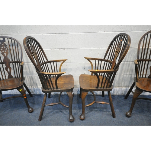 1286 - A SET OF FOUR EARLY 20TH CENTURY ELM AND BEECH HOOP BACK WINDSOR ARMCHAIR, with a wheel splat back, ... 