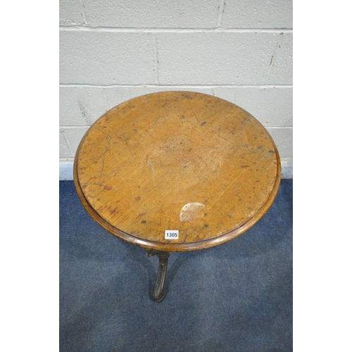 1305 - A CAST IRON CIRCULAR PUB TABLE, with a walnut top, diameter 61cm x height 70cm (condition report: th... 