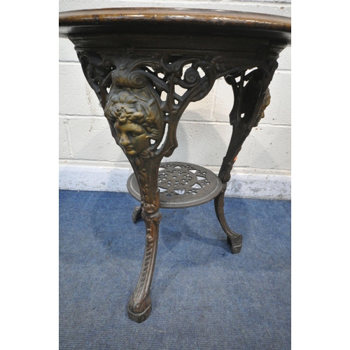 1305 - A CAST IRON CIRCULAR PUB TABLE, with a walnut top, diameter 61cm x height 70cm (condition report: th... 