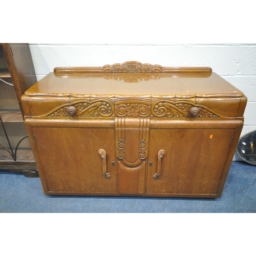 1310 - A 1940'S OAK SIDEBOARD, with two drawers and cupboard doors, width 137cm x depth 55cm x height 96cm,... 