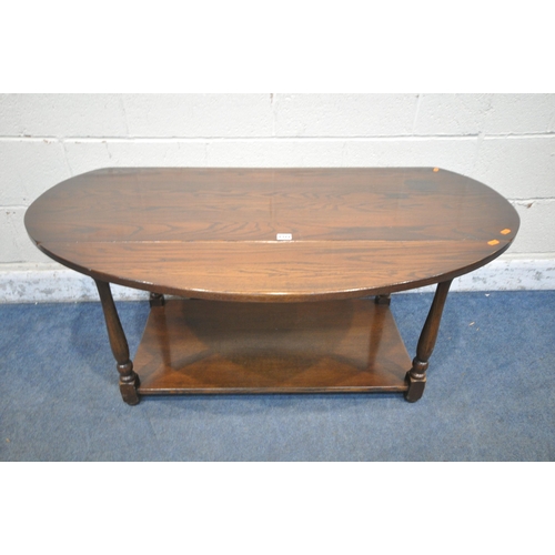 1322 - A REPRODUCTION OAK DROP LEAF COFFEE TABLE, on turned legs united by an undershelf, length 121cm x de... 