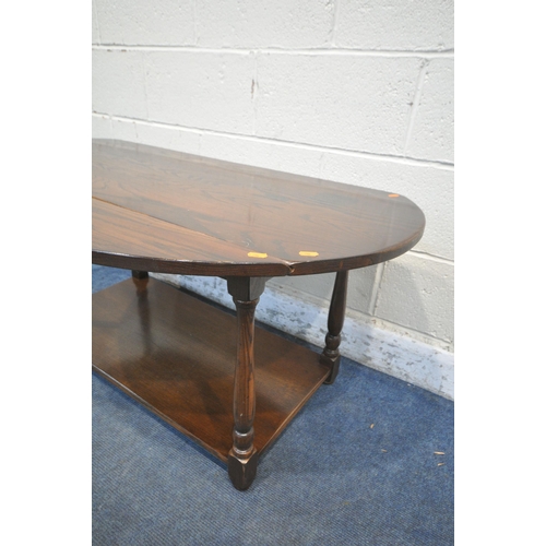 1322 - A REPRODUCTION OAK DROP LEAF COFFEE TABLE, on turned legs united by an undershelf, length 121cm x de... 