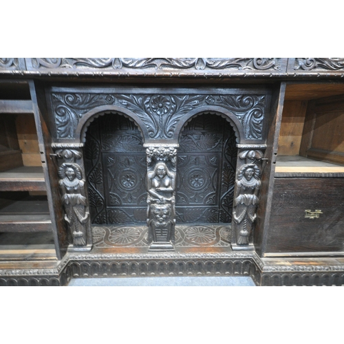 1327 - A 19TH CENTURY HEAVILY CARVED OAK SIDEBOARD, the raised back with panelling and shelf, fitted with t... 