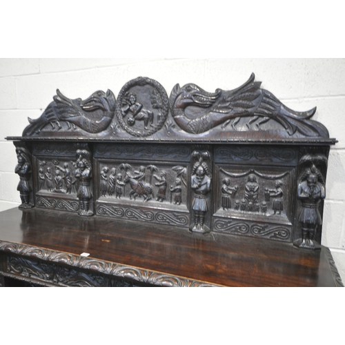 1327 - A 19TH CENTURY HEAVILY CARVED OAK SIDEBOARD, the raised back with panelling and shelf, fitted with t... 