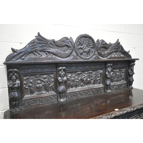 1327 - A 19TH CENTURY HEAVILY CARVED OAK SIDEBOARD, the raised back with panelling and shelf, fitted with t... 