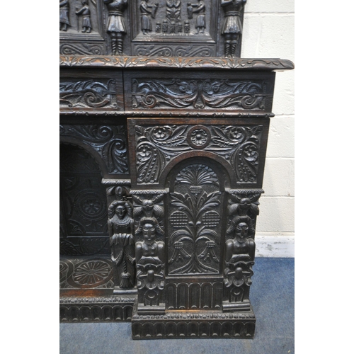 1327 - A 19TH CENTURY HEAVILY CARVED OAK SIDEBOARD, the raised back with panelling and shelf, fitted with t... 