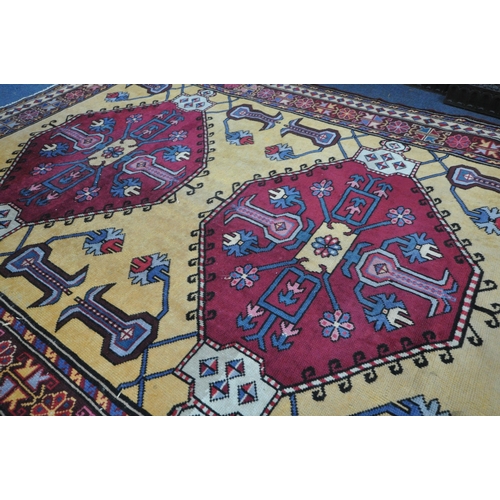 1331 - A LARGE PERSIAN KAZAK RUG, two conjoined medallions, surrounded by geometric detail, 256cm x 205cm (... 