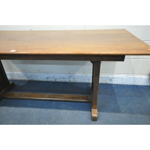 1334 - AN OAK TRESTLE DINING TABLE, united by a floor stretcher, length 182cm x 87cm x height 77cm (conditi... 