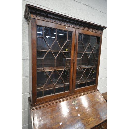 1339 - A GEORGIAN MAHOGANY BUREAU BOOKCASE, the top with blind fretwork and double astragal glazed doors, a... 