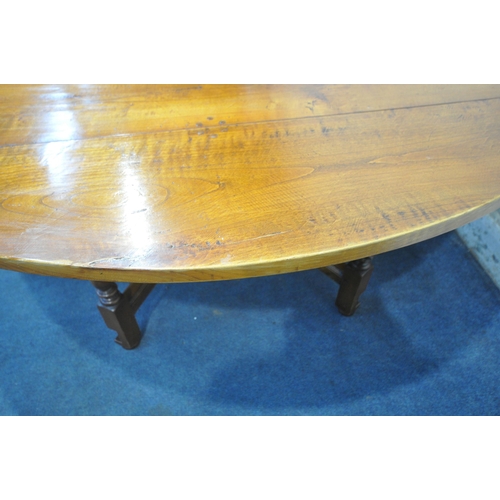 1347 - A GOOD QUALITY LARGE REPRODUCTION ELM DROP LEAF TABLE, with a single frieze drawer to each end, rais... 