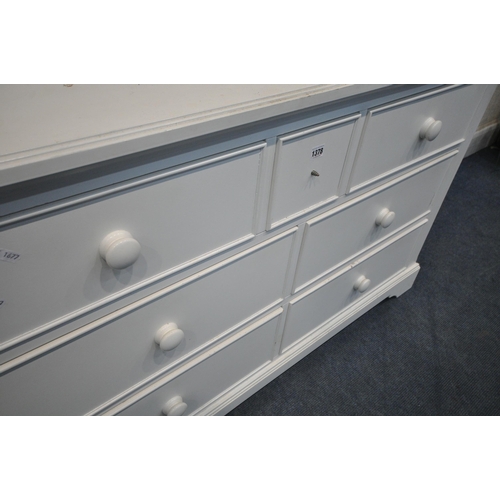 1378 - A MODERN WHITE SIDEBOARD, fitted with seven assorted drawers, length 134cm x depth 44cm x height 81c... 