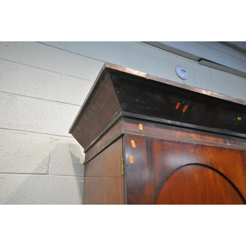 1384 - A 19TH CENTURY MAHOGANY LINEN PRESS, with a loose overhanging cornice, the double doors enclosing th... 