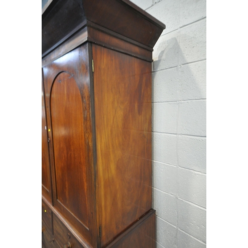 1384 - A 19TH CENTURY MAHOGANY LINEN PRESS, with a loose overhanging cornice, the double doors enclosing th... 