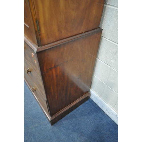 1384 - A 19TH CENTURY MAHOGANY LINEN PRESS, with a loose overhanging cornice, the double doors enclosing th... 