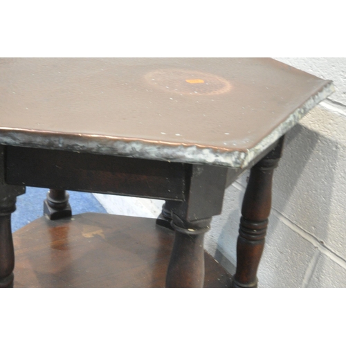 1385 - AN ARTS AND CRAFTS OAK HEXAGONAL OCCASIONAL TABLE, with a beaten copper top, raised on block and tur... 