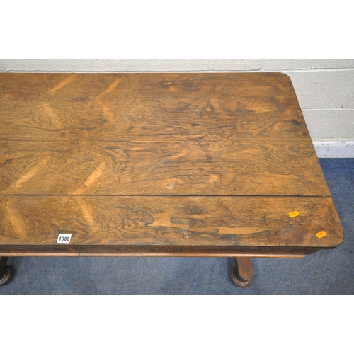 1388 - A WILLIAM IV ROSEWOOD LIBRARY TABLE, with two drawers, on twin cylindrical tapered legs, on flat bun... 