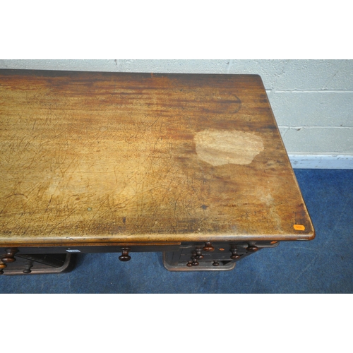 1389 - A VICTORIAN MAHOGANY TWIN PEDESTAL DESK, with an arrangement of nine drawers, on a plinth base, widt... 