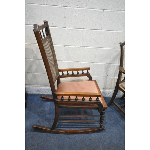 1396 - AN EDWARDIAN MAHOGANY BERGÈRE BACK ROCKING CHAIR, along with an oak open armchair, another armchair ... 