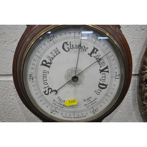 1401 - A CIRCULAR GILT FRAMED CONVEX WALL MIRROR, diameter 52cm, along with a carved oak barometer (conditi... 